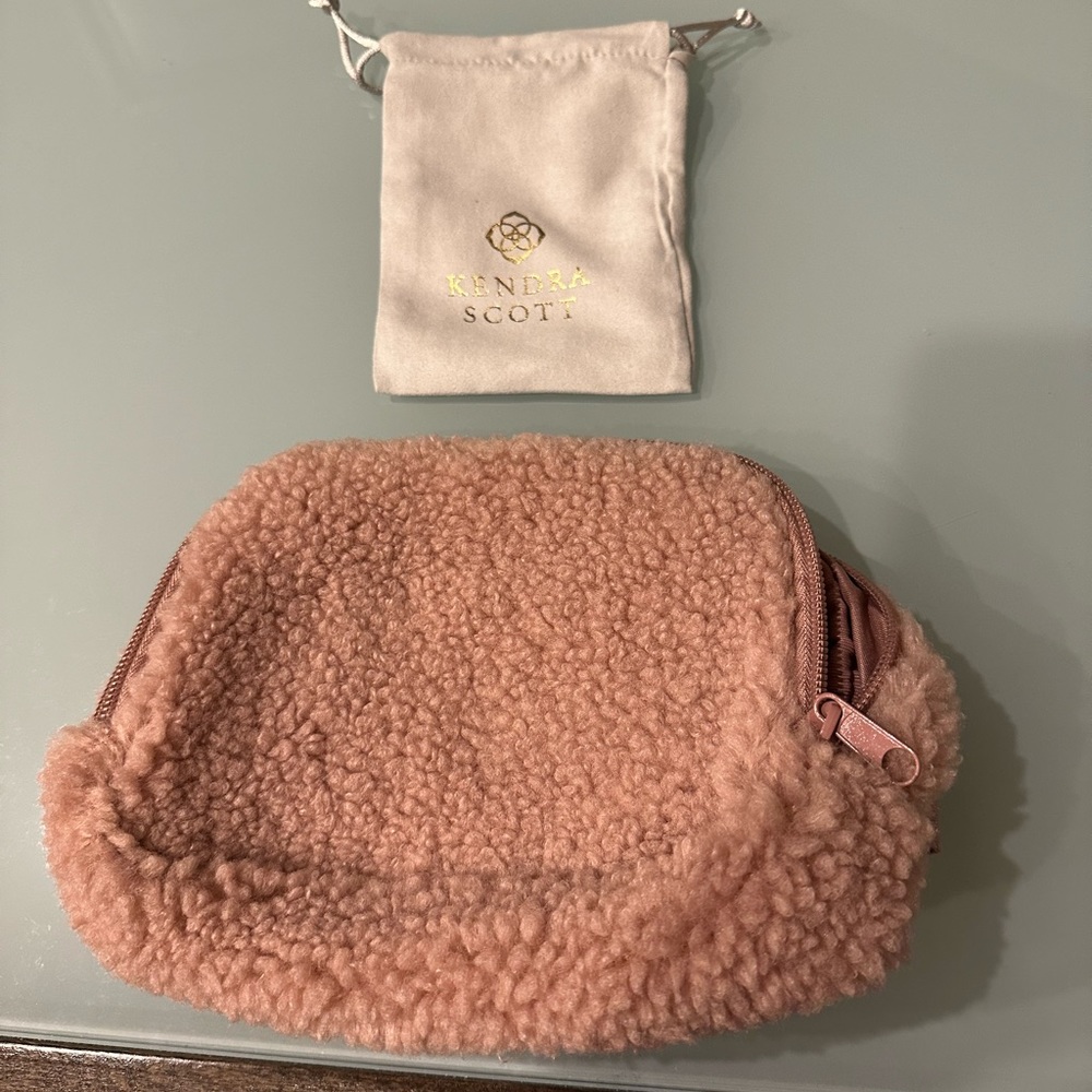 Three Kendra Scott bags plus small pink fuzzy bag